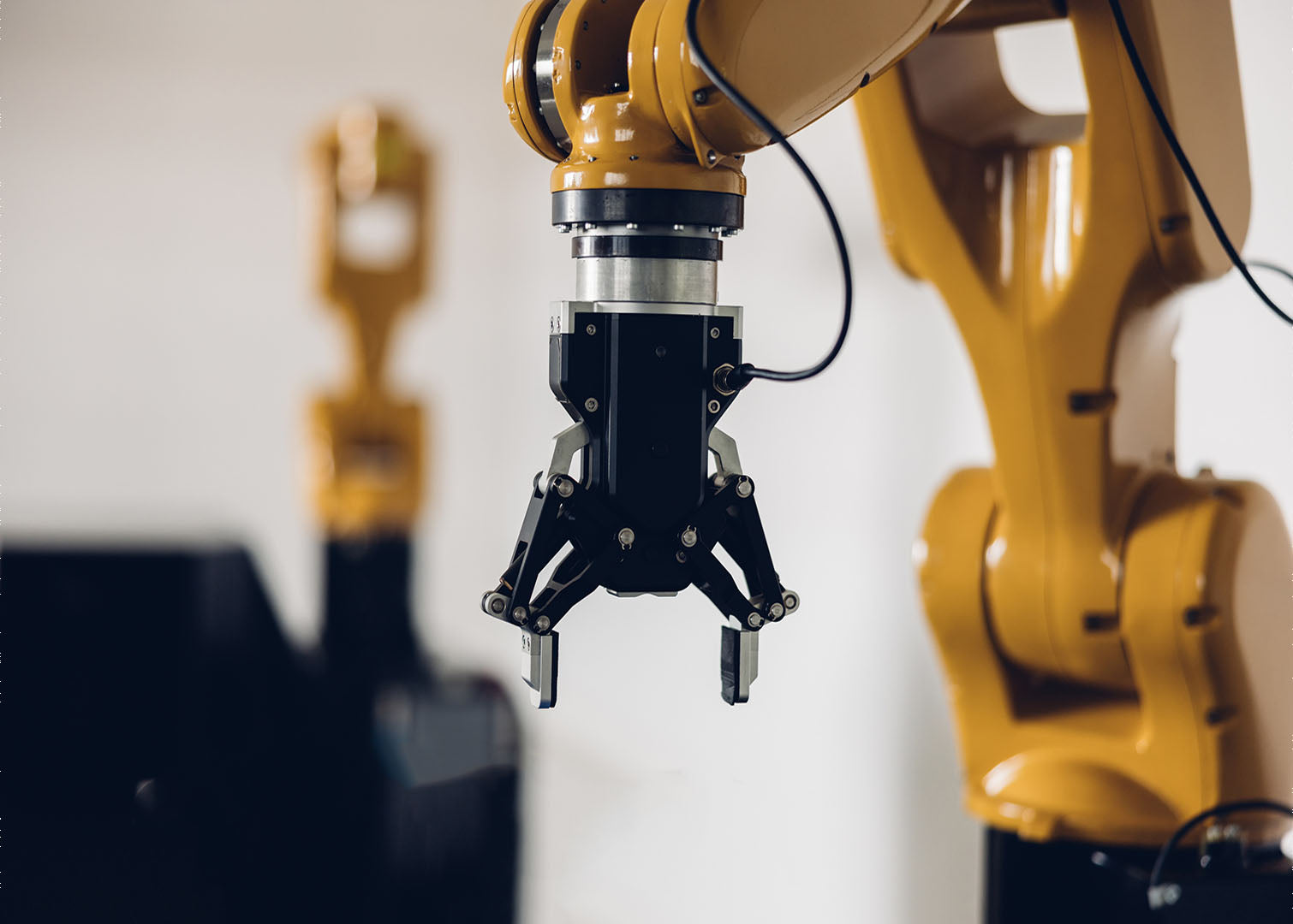 Close-up of industrial robotic arm gripper used in automated manufacturing and robotics integration